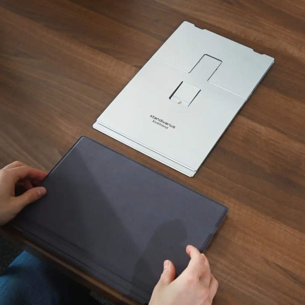 A flat-folded Standivarius KickStand ergonomic stand for Surface Pro demonstrating its ultra-thin profile.